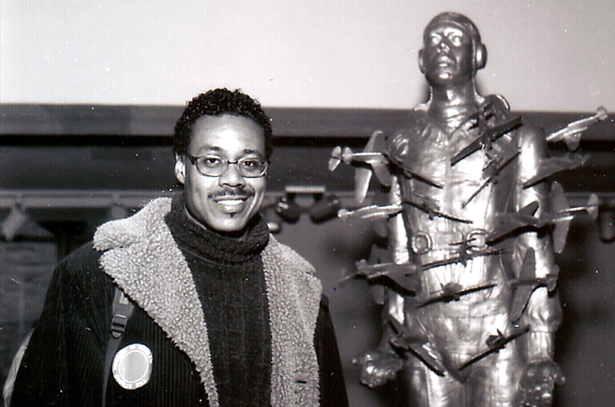 Michael Richards, portrait in front of Tar Baby vs St Sebastian, 1999